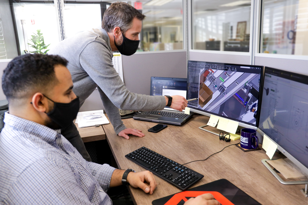 WayneRamzy_Office 2 Engineers discussing design improvements